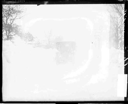 Locomobile automobile sitting amid snowdrifts during a New York-Paris automobile race - Chicago Daily News, Inc.