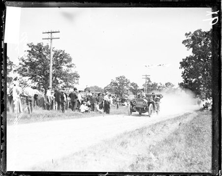 Unidentified man driving an automobile up a hill during the Algonquin Hill Climbing Contest - Chicago Daily News, Inc.