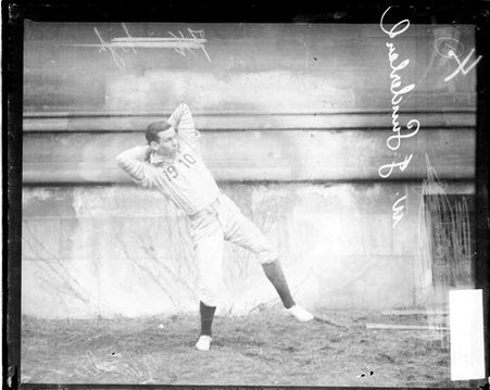 University of Chicago baseball player W. J. Sunderland winding up to throw a baseball - Chicago Daily News, Inc.
