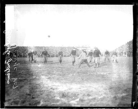 Carlisle Indians and the University of Chicago football game, players walking towards a referee on an athletic field - Chicago Daily News, Inc.