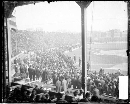 Crowds standing in the grandstands and in a field level seating area during the 1907 World Series at West Side Grounds - Chicago Daily News, Inc.