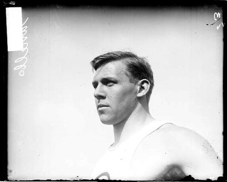 Athlete J. C. Garrells looking to the left of the camera, standing outdoors - Chicago Daily News, Inc.