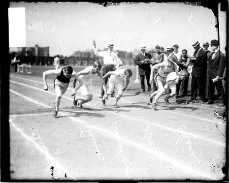 Runners Armstrong, Lamm, Hall, Chase, and John Breathed racing on an athletic track - Chicago Daily News, Inc.