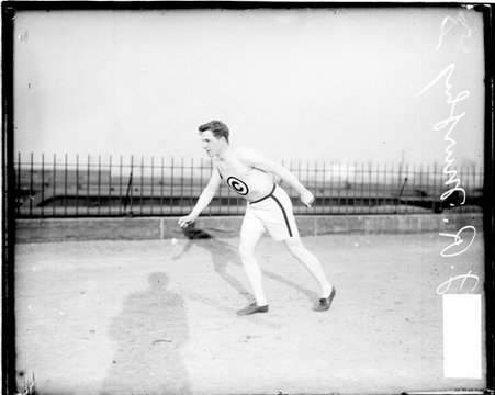 Chicago Athletic Association athlete J. R. Murphy standing and leaning forward in a ready position - Chicago Daily News, Inc.