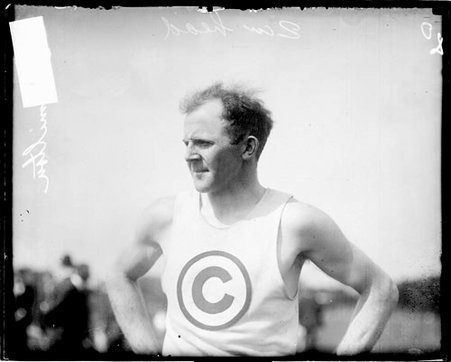 Athlete Frank Hamilton looking to the left of the camera, standing on an athletic field - Chicago Daily News, Inc.