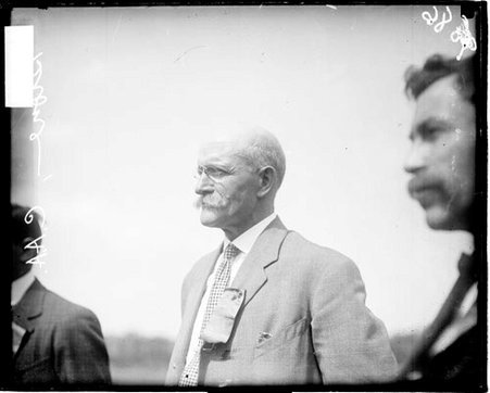F. W. Stone, C. A. .A (Chicago Athletic Association) track team coach, standing outdoors - Chicago Daily News, Inc.