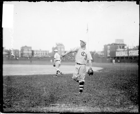 Baseball player Mordecai Brown following through after throwing a baseball - Chicago Daily News, Inc.