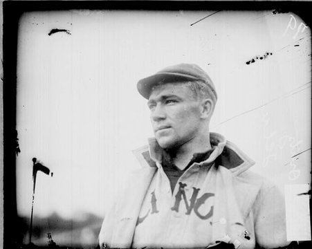 Illinois University baseball player E. Ovitz standing outdoors - Chicago Daily News, Inc.