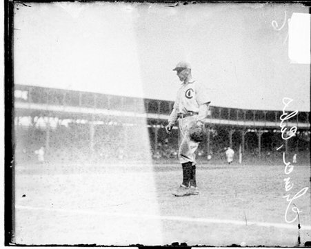 Baseball player Frank Chance, Chicago Cubs, standing near first base on the field - Chicago Daily News, Inc.