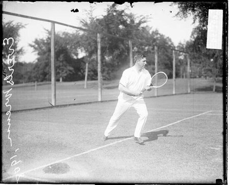 Tennis player Everts Wrenn holding a tennis racket, running forward from the baseline - Chicago Daily News, Inc.