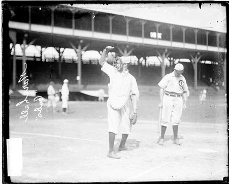 Catcher W. R. Marshall, Chicago Cubs, holding his hand above his head and looking to his right - Chicago Daily News, Inc.