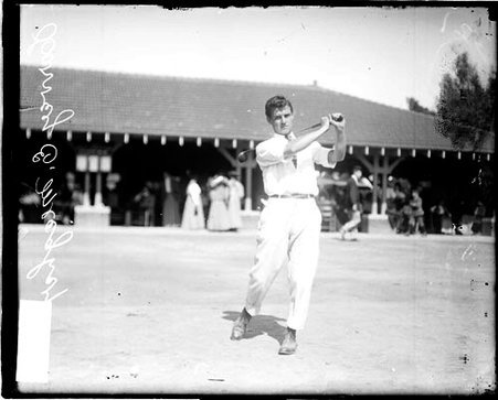 Golfer Harvey E. Meagler holding a golf club over his shoulder - Chicago Daily News, Inc.