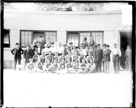 Members of the Chicago Rowing Club posing in front of a low building - Chicago Daily News, Inc.