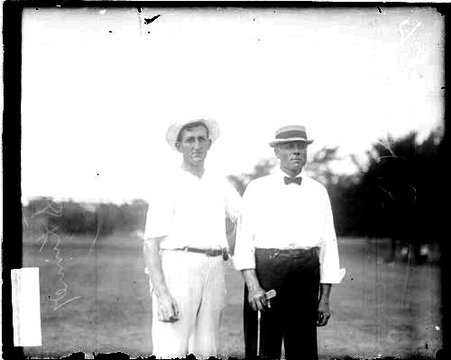 Golfers C. P. Skinner and R. H. Aiken standing on the grounds of an unidentified golf course - Chicago Daily News, Inc.