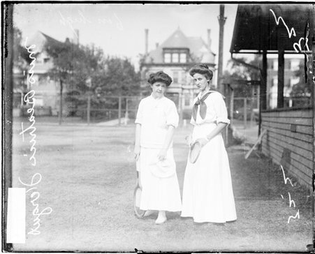 Tennis players Miss Beatrice Fergus and an unidentified woman holding tennis rackets - Chicago Daily News, Inc.