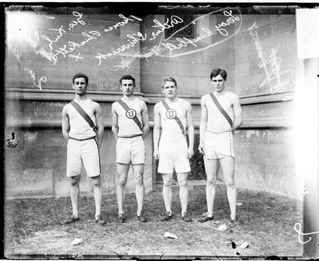 High school athletes Kuh, Shiverick, Campbell, and Plunkett, standing in front of a building - Chicago Daily News, Inc.