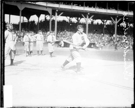 Baseball player Charles Schmidt, Detroit Tigers, following through after swinging a baseball bat - Chicago Daily News, Inc.