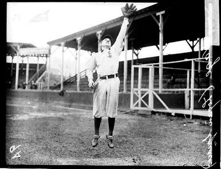Baseball player Hage, Logan Square, jumping and reaching up in the air with his gloved hand - Chicago Daily News, Inc.