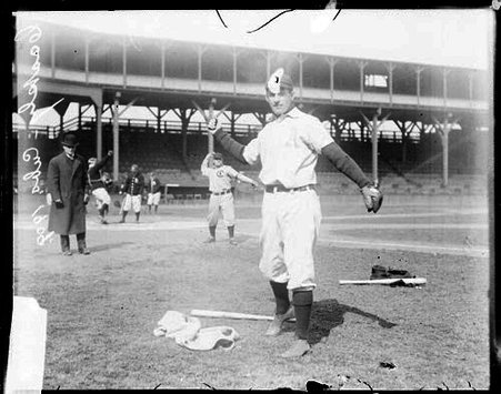 Baseball player A. J. Coakley, Chicago Cubs, cocking his arm back, standing in foul territory - Chicago Daily News, Inc.