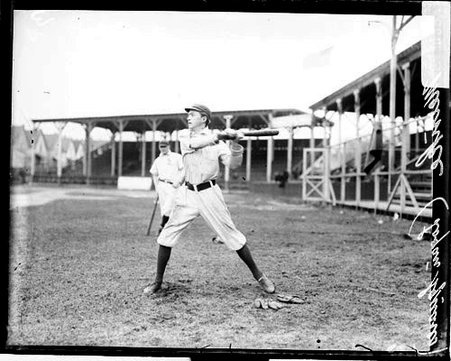 Baseball player Bob Meinke, Logan Square, swinging a baseball bat - Chicago Daily News, Inc.