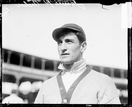 Baseball player James P. Archer, Chicago Cubs, standing on the field at West Side Grounds - Chicago Daily News, Inc.