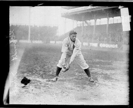 Baseball player Charles Schmidt, Detroit, leaning forward and holding his hands low and in front of him - Chicago Daily News, Inc.