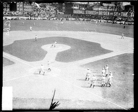 Unidentified pitcher, Chicago Cubs, following through after pitching a baseball, on the pitcher's mound - Chicago Daily News, Inc.