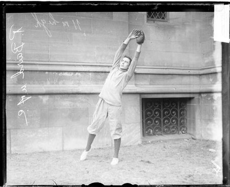 University of Chicago baseball player R. Baird reaching with his hands above his head - Chicago Daily News, Inc.