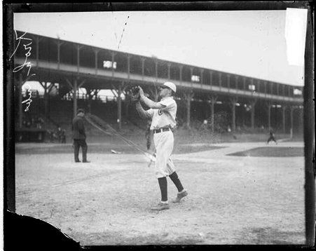 Baseball player Kroh, Chicago Cubs, holding his hands in front of him to catch a baseball - Chicago Daily News, Inc.