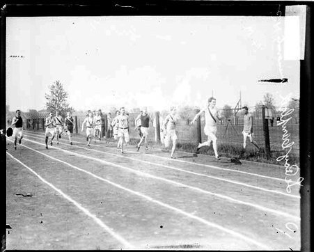 University High School runner Leroy Campbell racing a group of runners on an athletic track - Chicago Daily News, Inc.