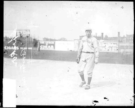 Baseball player Tris Speaker, Cleveland, standing near first base on the field at South Side Park - Chicago Daily News, Inc.