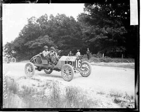 Automobile driver Wiseman sitting in the driver's seat of a Stoddard-Dayton automobile during the Cobe Cup Race - Chicago Daily News, Inc.