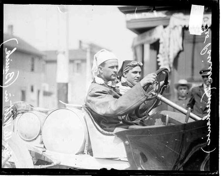 Automobile driver D. De Witt sitting in the driver's seat of a Buick automobile parked in front of a building during the Cobe Cup Race - Chicago Daily News, Inc.