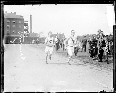 Runners Herrick of Illinois, and Comstock of the University of Chicago, racing on the track at Marshall Field - Chicago Daily News, Inc.