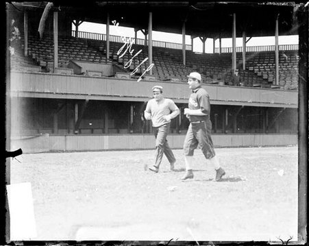 Boxer, James J. Jeffries and an unidentified Chicago White Sox player, jogging in front of grandstands - Chicago Daily News, Inc.