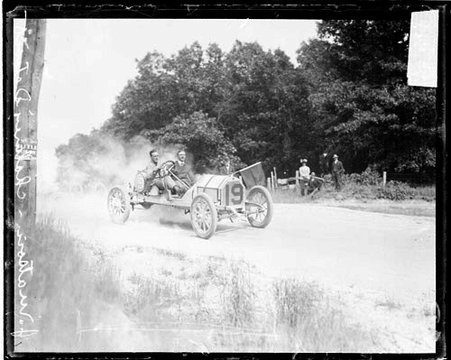 Automobile driver Joe Matson driving a Chalmers Detroit automobile on a dirt road, during the Cobe Cup Race - Chicago Daily News, Inc.