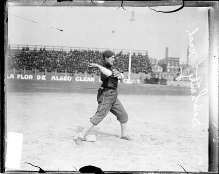 Baseball player Jim Delahanty, Washington Senators, cocking his arm to throw a baseball - Chicago Daily News, Inc.