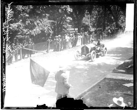 Automobile driver Bert Miller driving a Stoddard-Dayton automobile on a road during the Cobe Cup Race - Chicago Daily News, Inc.