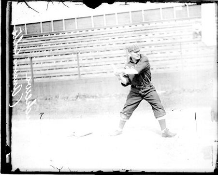 Baseball player Andrews or Aschews, Anson's Colts, swinging a baseball bat, standing in front of grandstands - Chicago Daily News, Inc.