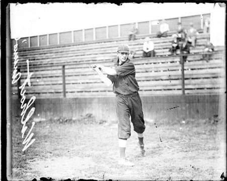 Baseball player, Anson's Colts, following through after swinging a baseball bat - Chicago Daily News, Inc.