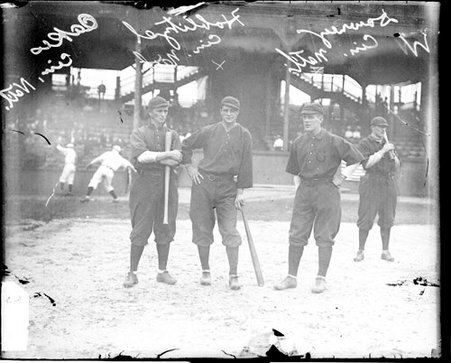 Baseball players Oaks, Downey, and Hoblitzel, Cincinnati, standing on the field at West Side Grounds - Chicago Daily News, Inc.