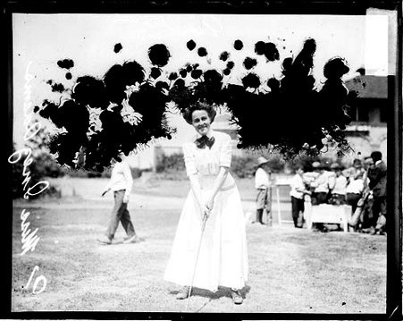 Golfer Miss Inez Adams gripping a golf club in an address position at South Shore Country Club - Chicago Daily News, Inc.