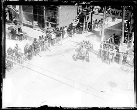 Automobile driver Ruel driving an automobile around a street corner, image may have been taken during the Cobe Cup Race - Chicago Daily News, Inc.