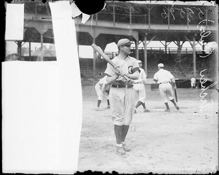 Baseball player James P. Archer, Chicago Cubs, holding a baseball bat on the field at West Side Grounds - Chicago Daily News, Inc.