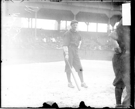 Baseball player Miller, Cincinnati, holding a bat at his side, standing on the field at West Side Grounds - Chicago Daily News, Inc.