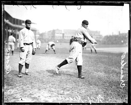 Baseball player Crandall, New York Giants, following through after throwing a baseball at West Side Grounds - Chicago Daily News, Inc.