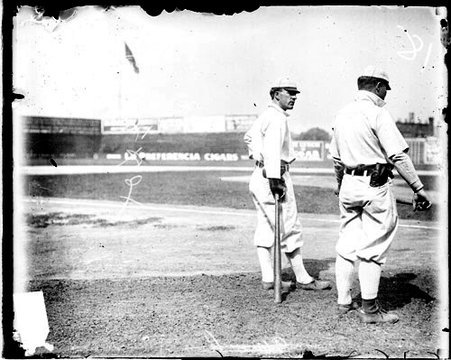 Baseball player Cole, Chicago White Sox, leaning on a baseball bat on the field at South Side Park - Chicago Daily News, Inc.