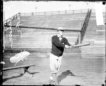 University of Chicago baseball player H. Ehrohorn holding a baseball bat, standing in a hitting position at Marshall Field - Chicago Daily News, Inc.