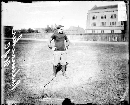 University of Chicago football player Rademacher standing on the field at Marshall Field - Chicago Daily News, Inc.
