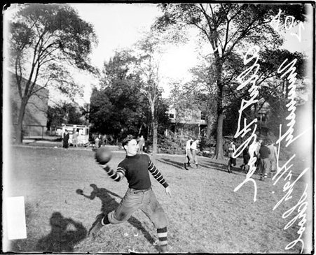 University High School football player Albert Flood cocking his arm to throw a football - Chicago Daily News, Inc.
